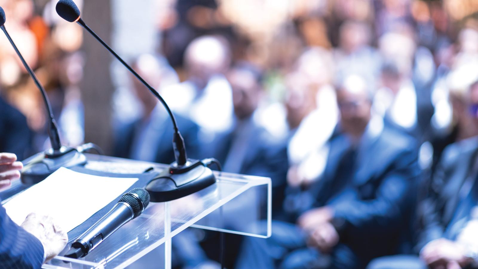 Image of a speaker at a conference